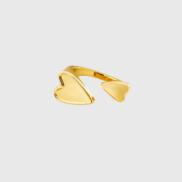 Gold double-heart open ring on white marble surface – Adallet Ring by Matte.