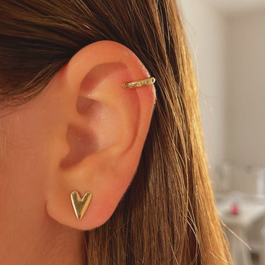Gold plated ear cuff on models ear