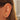 Gold plated ear cuff on models ear