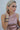 Model wearing the Alameda Sleeveless Top — rose gold metallic high-neck sleeveless blouse, close up.