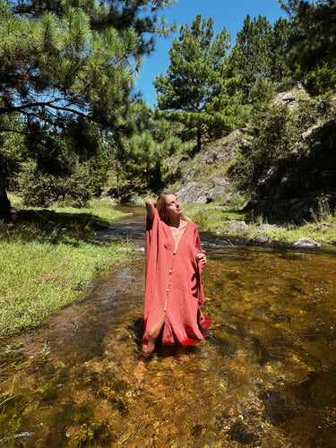 Alba Cover Up lightweight coral maxi cover up dress worn in shallow river natural outdoor setting full length front view