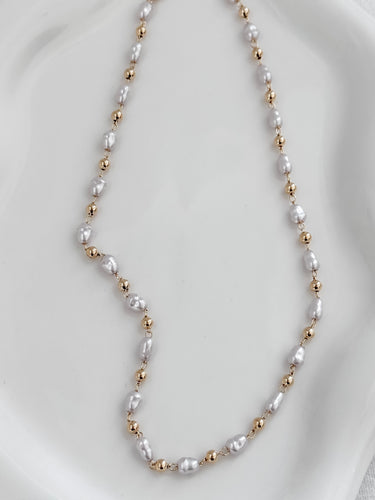 Alexa gold plated necklace with 3mm pearls on white background, minimal and versatile design