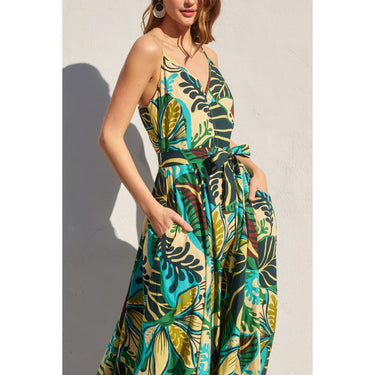 Amura Maxi Dress three-quarter angle view showing spaghetti straps, hidden pockets, and cinched waist tie.