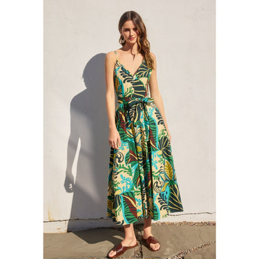 Amura Maxi Dress front view on model wearing tropical green botanical print maxi dress.