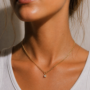 Arin Necklace delicate gold chain with tiny zirconia pendant, minimalist dainty necklace worn on neck with subtle sparkle and polished finish.