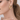 Pearl Gold Hoop Earrings on model ear, gold hoop with single row of white pearls, editorial close-up
