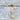 Astra Necklace by Matte – gold star pendant on delicate chain, perfect for shining bright. Gold filled star necklace with star-shaped pendants and earrings laid out on a textured surface.