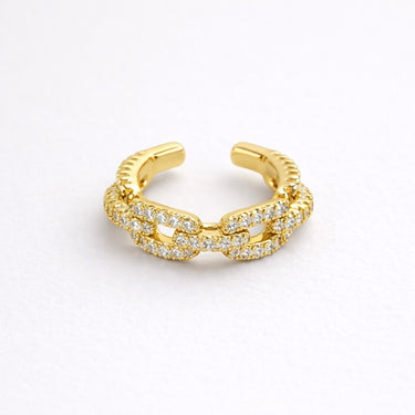 Astromellia Ring gold pavé chain link open ring with interlocking bands and shimmering stones modern adjustable statement ring on neutral background.