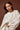 Woman wearing relaxed neutral Aural sweatshirt .
