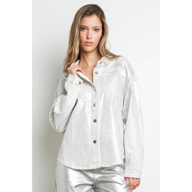 Shiny silver metallic shirt jacket with soft drape, structured stitching, and luxe foil texture, worn by model for a chic elevated look — Aurea Shirt Jacket.