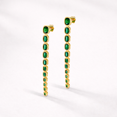 Blow Stud Earrings gold drop earrings with vibrant green stones, long elegant silhouette.
