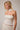 Bonyo Top worn on model featuring polka dot halter neckline and fitted bodice.