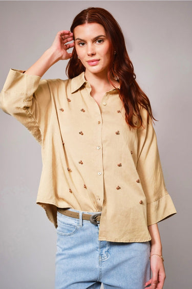 Bornandt Blouse worn by model, front view, showing button-front design and soft structured shape, tucked into jeans.