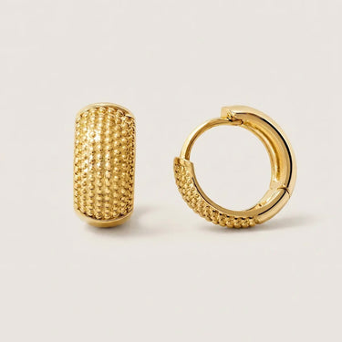 Brussels Huggie Earrings textured gold huggie hoop earrings with polished finish and raised bead detailing on neutral light background