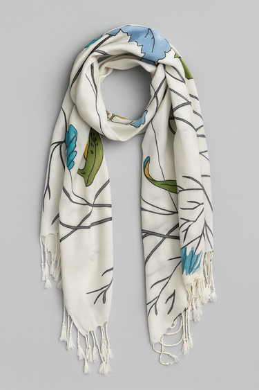Carcassonne Scarf — ivory scarf with turquoise, green, and blue botanical print, fringed edges, lightweight and soft texture by Matte.