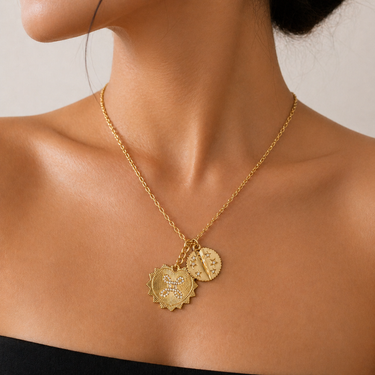 Ceke Necklace gold layered charm necklace worn on neck with coin pendant and heart charm, delicate chain and warm gold tone