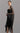 Chalat Kimono worn by model, side view, highlighting dramatic fringe and metallic crochet finish.