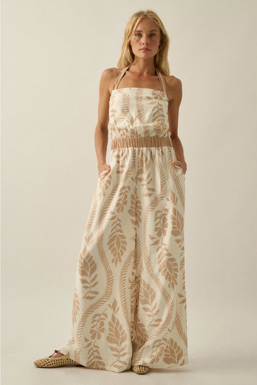 Ciguu Printed Halter Jumpsuit front view showing wide leg silhouette and neutral resort print