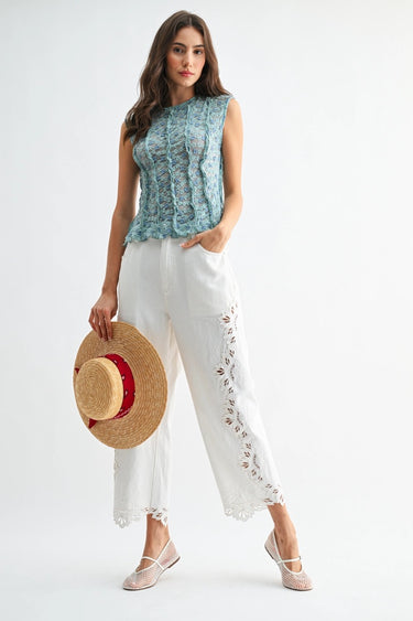 Clea Pant full outfit styling with embroidered white pants and sleeveless top on model.