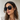 Dalia Sunglasses worn on model featuring oversized square black frame with dark lenses for a bold, modern look.