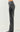 Side view of black faux leather pants showing high waist and smooth finish.