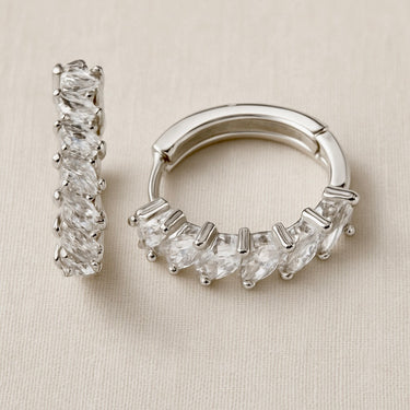 Dorian Huggie Earrings with faceted clear stones and polished silver huggie design