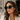 Dorina Sunglasses worn on model featuring oversized square frame in dark tone with gradient lenses for an elevated everyday style.