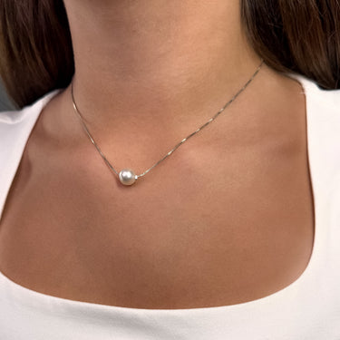 Elara Necklace silver version on a models neck.