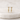 Gold triangle-shaped earrings with embedded stones on a white cushion