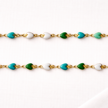 Eloide Necklace close-up detail of heart charms in vibrant green, turquoise, and white.