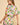 Side angle of Enus Top highlighting dropped shoulders, balloon sleeve shape, and airy cotton fabric.