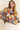 Eon Sweater styled casually with relaxed jeans, colorful knit design.