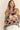 Playful multicolor knit Eon Sweater, oversized fit, front pose.
