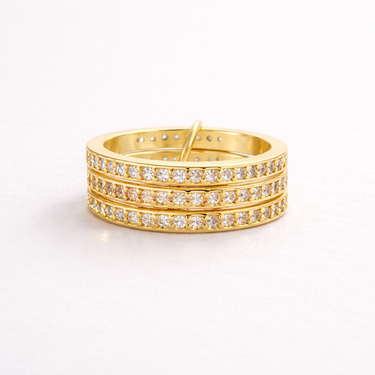 Ezer Ring multi-row pavé band ring with clear stones in gold finish on neutral background
