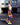 Model wearing multicolor geometric print wide-leg pants with white tee — vibrant resort look.