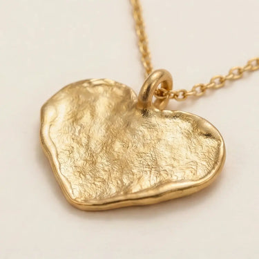 Ikigai Heart Necklace gold plated flat heart pendant with adjustable chain styled on neutral background