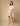 Full view of Irvine Tunic showing pastel abstract print and lace-up neckline with tassels.