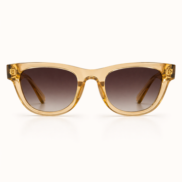 Joss Sunglasses with chunky translucent beige frame, soft square shape, and brown gradient lenses for a modern oversized look.