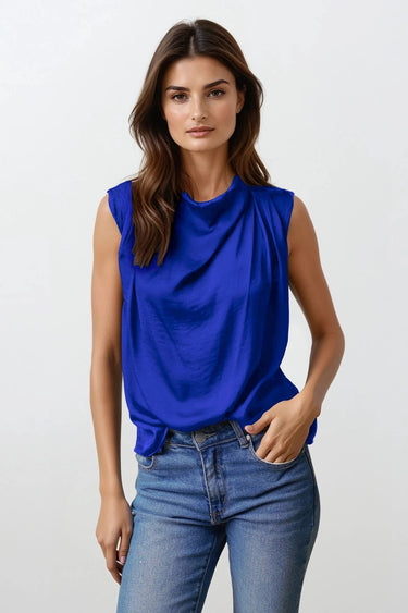 Kian Top worn by model, front view, featuring blue sleeveless draped neckline and soft flowing silhouette
