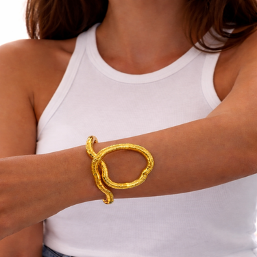 Kime Flexible Wrap Bracelet gold sculptural bracelet worn on wrist adjustable flexible jewelry.