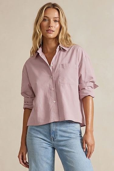 Lad Shirt styled with light pink shirt and blue jeans front view on model.