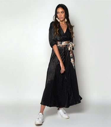 Lawery Wrap Dress black wrap-style maxi dress front view on model with sash belt.