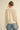 Back view of Liberty Knit Sweater in cream open-knit design