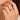 Two-tone gold and diamond triple link ring with pavé diamonds worn on woman’s finger close-up hand model