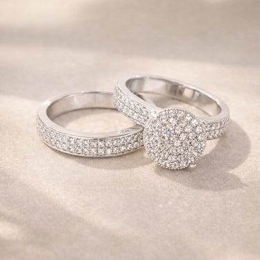 Lumi Stack Ring pavé cluster ring with round center design and a band ring with shimmering stones in silver finish statement stacking ring on neutral background