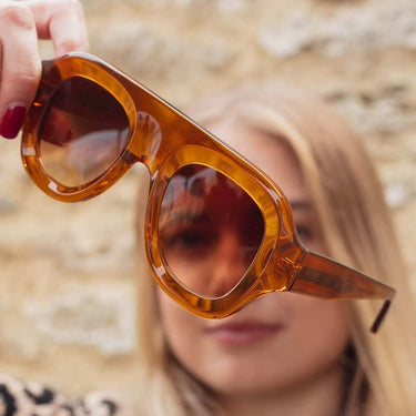 Mirage Sunglasses tortoiseshell oversized sunglasses worn on model warm-toned statement eyewear.