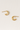 Moon Stud Earrings — gold-plated crescent-shaped earrings with smooth mirror finish on linen background, minimal and elegant by Matte.