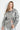 Glossy silver oversized jacket with futuristic metallic finish and effortless drape, styled for a bold night-out look — Narat Jacket.