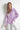 Relaxed pose of model wearing Noema Lilac Shirt in lilac cotton for casual chic style.