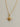 Close-up of Nova Necklace showing polished gold star pendant and delicate chain.